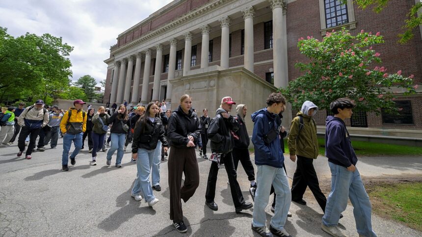 Students from Quebec, Canada, tour the campus of Harvard University in Cambridge, Massachusetts, on Friday