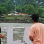 Local residents at a tourists point in Karen, in the Neelum Valley near on the Line of Control (AP photo)