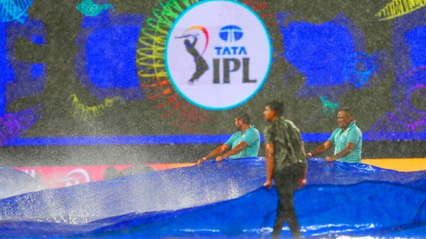 SRH vs DC: Groundsmen drag covers as rain stopped play during match 55 of the Indian Premier League (IPL 2025) between Sunrisers Hyderabad and Delhi Capitals at the Rajiv Gandhi International Stadium, Hyderabad. (Sportzpics for IPL)