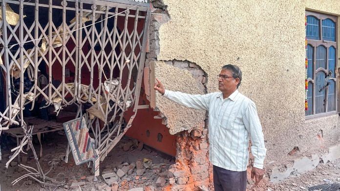 A civilian shows a damaged property after heavy firing and shelling by Pakistan military Wednesday across the Line of Control and International Border in Rajouri district, Jammu and Kashmir | PTI