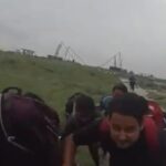 Individuals stranded in the middle of the flooded Bomjir river, in the Lower Dibang Valley of Arunachal Pradesh, rescued. (Screenshot: X: @ANI_News)