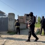 A National Investigation Agency team conducts raid at a locations in in Kulgam on Thursday