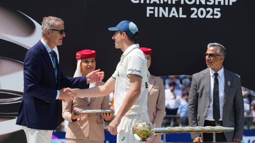 Australia's captain Pat Cummins is greeted by an official during the presentation ceremony after their loss in the World Test Championship final against South Africa at Lord's cricket ground in London, Saturday, June 14, 2025. (AP Photo)