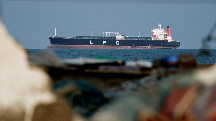 FILE PHOTO: An LPG gas tanker at anchor as traffic is down in the Strait of Hormuz, amid the U.S.-Israeli conflict with Iran, in Shinas, Oman, March 11, 2026. | REUTERS/Benoit Tessier/File Photo
