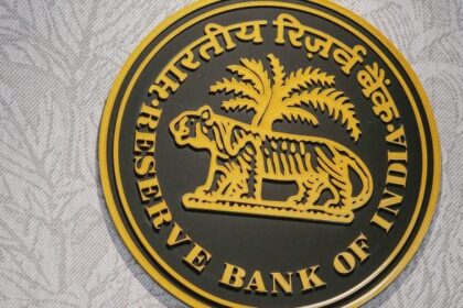 The Reserve Bank of India (RBI) logo at the central bank's headquarters in Mumbai, India, on Wednesday, Aug. 6, 2025. RBI Governor Sanjay Malhotra said the country contributes more to global growth than the US, responding to President Donald Trumps recent remark dismissing the South Asian nation as a dead economy. | Photographer: Dhiraj Singh/Bloomberg