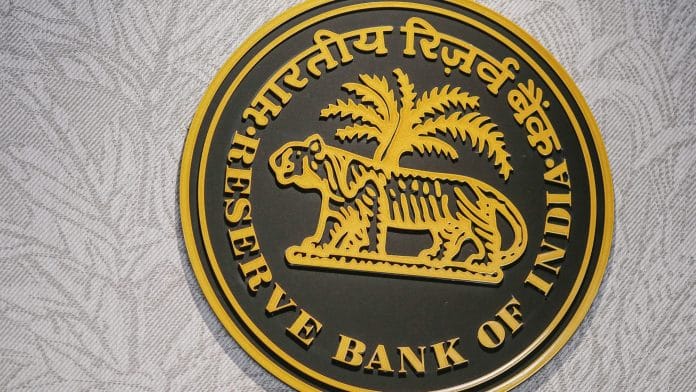 The Reserve Bank of India (RBI) logo at the central bank's headquarters in Mumbai, India, on Wednesday, Aug. 6, 2025. RBI Governor Sanjay Malhotra said the country contributes more to global growth than the US, responding to President Donald Trumps recent remark dismissing the South Asian nation as a dead economy. | Photographer: Dhiraj Singh/Bloomberg