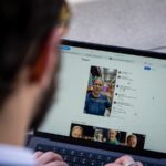 Josemaria Silvestrini, the owner of Modern Antidote, with a video of the Melanskia artificial intelligence avatar, in Beijing