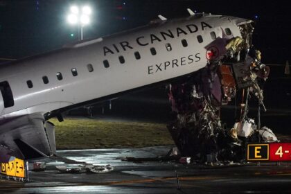 An Air Canada Jet sits on the runway at LaGuardia Airport, Monday, March 23, 2026, after colliding with a Port Authority aircraft rescue and firefighting vehicle after landing in New York. (AP Photo)
