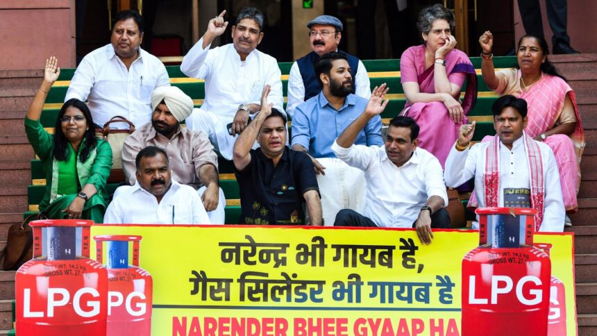 Lok Sabha MPs Hibi Eden, Prashant Yadaorao Padole, Chamala Kiran Kumar Reddy, Amrinder Singh Raja Warring, B. Manickam Tagore with other MPs protest at the Parliament premises over the reports of nationwide shortage of LPG gas cylinders, during the ongoing Budget Session, in New Delhi on Monday. (ANI Photo)