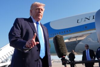 President Donald Trump speaks with the media before boarding Air Force One, Monday, March 23, 2026, at Palm Beach International Airport in West Palm Beach, Fla. (AP Photo/Mark Schiefelbein)