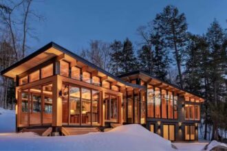 Barlochan Cottage features a private dock, expansive western-facing windows designed to catch sunsets