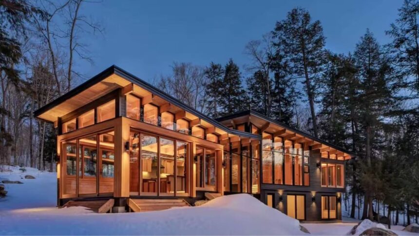 Barlochan Cottage features a private dock, expansive western-facing windows designed to catch sunsets