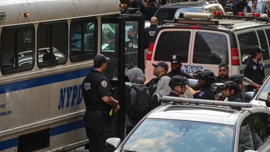Demonstrators who occupied the Butler Library on the Columbia University campus are taken into custody in New York