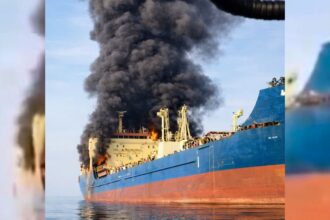 Smoke billows out from an oil tanker