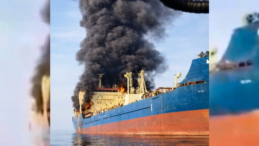 Smoke billows out from an oil tanker