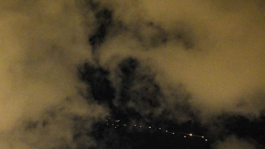 An Iranian missile with cluster munitions flies toward Israel, as seen from Tel Aviv, March 9. REUTERS