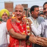 AAP leader Manish Sisodia being welcomed during a meeting with party workers, in Jammu