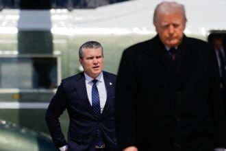 Defense Secretary Pete Hegseth follows President Donald Trump to board Air Force One amid the war with Iran. (AP Photo)
