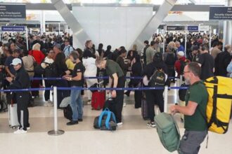 Airline passengers wait in long lines to get through the TSA security screening at George Bush Intercontinental Airport in Houston