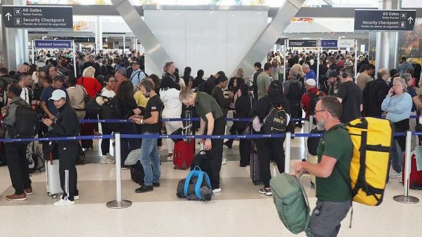 Airline passengers wait in long lines to get through the TSA security screening at George Bush Intercontinental Airport in Houston