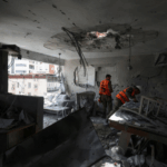 Soldiers inspect remains of an apartment struck in an Iranian missile attack in Ramat Gan, Israel on Wednesday. | Nir Elias/Reuters