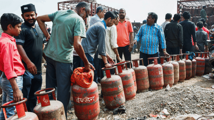 People stand in a queue with their LPG cylinders outside a gas agency in Prayagraj on 11 March 2026 | ANI