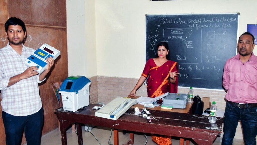 Guwahati [Assam], Mar 17 (ANI): Electoral officer(s) demonstrate the functioning of Electronic Voting Machine (EVM) and Voter Variable Paper Audit Trail (VVPAT) during a special training of women polling and presiding officers ahead of the Assam Legislative Assembly Election 2026 in Guwahati on Tuesday. (ANI Photo)