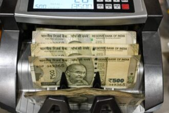 500 rupee banknotes counted by a cash counting machine at a currency exchange in New Delhi, India, on Saturday, Aug. 30, 2025. The Indian rupee slumped to a record low versus the dollar on concern that 50% US tariffs will hurt the countrys economic growth and corporate earnings. | Photographer: Prakash Singh/Bloomberg
