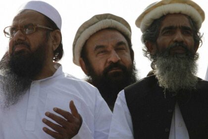 Maulana Amir Hamza (centre), a Lashkar-e-Taiba commander, was shot by unidentified assailants outside a news channel office in Lahore, Pakistan, on April 16. (AP/File)