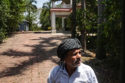 Along a shiny new expressway, a sole house and its lone caretaker are the face of an old fight