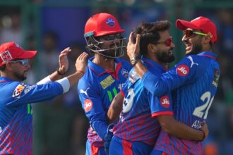 Delhi Capitals' Vipraj Nigam, second left, celebrates the wicket of Mumbai Indians' Shefane Rutherford with captain Axar Patel. (Photo: AP)