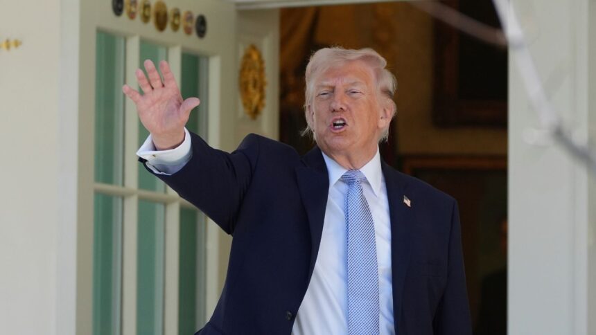 President Donald Trump gestures as he prepares to head back to the Oval Office after participating in the White House Easter Egg Roll on the South Lawn of the White House. (AP Photo)