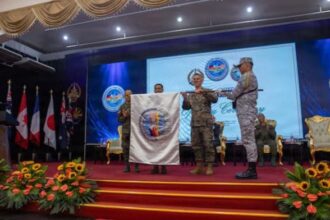 US and Philippine military personnel unfurl the Exercise Balikantan 2026 flag during the opening ceremony in Manila. | Pacom.mil