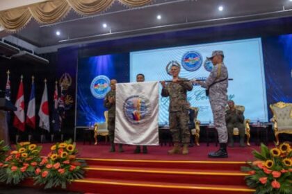 US and Philippine military personnel unfurl the Exercise Balikantan 2026 flag during the opening ceremony in Manila. | Pacom.mil