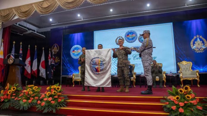 US and Philippine military personnel unfurl the Exercise Balikantan 2026 flag during the opening ceremony in Manila. | Pacom.mil