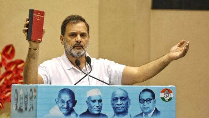 Congress Leader and Leader of Opposition Rahul Gandhi showing The Constitution of India during address his party leaders and supporters at Vigyan Bhawan | Praveen Jain | ThePrint
