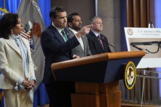 From left, U.S. Attorney Jeanine Pirro, Acting Attorney General Todd Blanche, FBI Director Kash Patel, and Acting Assistant Director for the Criminal Investigative Division at the FBI, Darren Cox, speak during a news conference at the Department of Justice
