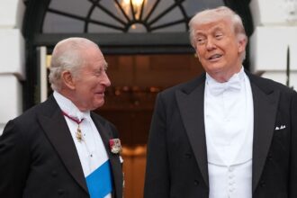 President Donald Trump greets Britain's King Charles III at the South Portico of the White House for a State Dinner Tuesday, April 28, 2026, in Washington. (AP