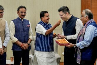 Raghav Chadha, Sandeep Pathak and Ashok Mittal with BJP president Nitin Nabin and party leaders Anil Baluni (extreme left), Tarun Chugh and Arun Singh (extreme right) at the BJP headquarters in New Delhi, Friday. (PTI)
