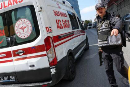 A police officer works at the scene, after gunfire was heard near the building housing the Israeli consulate, according to a witness, in Istanbul, Turkey, April 7, 2026. REUTERS/Murad Sezer