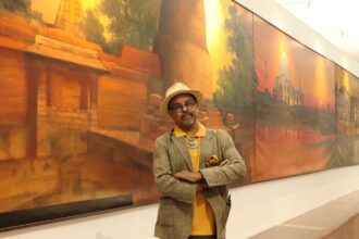 Artist Paresh Maity with his 100 x 8 ft canvas titled Jagriti (Awakening)