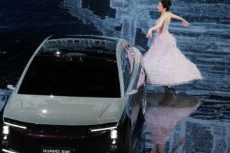 A dancer performs next to a Maextro S800 electric vehicle (EV) at Huawei's Automotive Technology Conference in Beijing, China April 23, 2026. (Photo: Reuters)