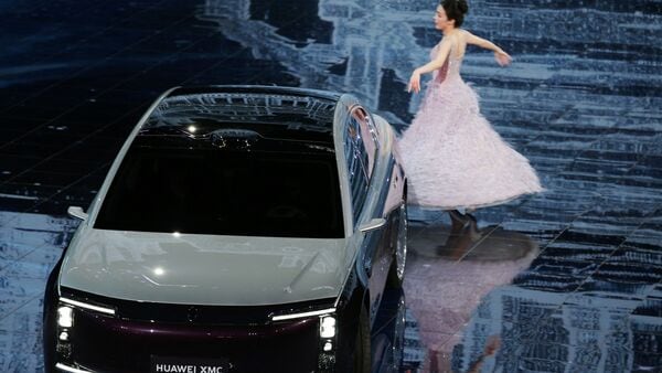 A dancer performs next to a Maextro S800 electric vehicle (EV) at Huawei's Automotive Technology Conference in Beijing, China April 23, 2026. (Photo: Reuters)
