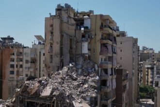 Rescue workers search through the rubble of a building destroyed in an Israeli airstrike the previous day in Dahiyeh, Beiruts southern suburbs, Lebanon, Thursday, May 7, 2026. (AP Photo)