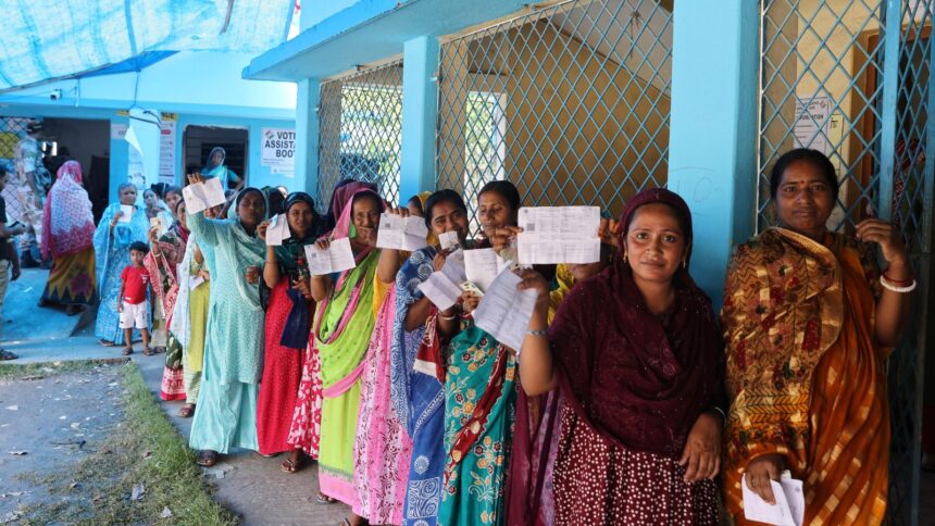 Voters queue outside Bahirpua Kurkuria F.P. School polling station under the Magrahat Paschim Assembly constituency of South 24 Parganas district. (Express photo by Partha Paul)