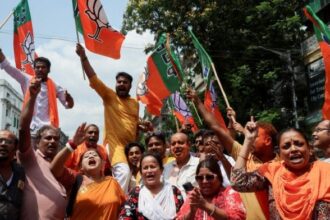 BJP supporters celebrate outside party office in Kolkata on 4 May, 2026 | Sahiba Chawdhary/Reuters