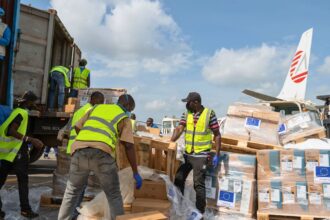 Workers offload medical and emergency supplies donated by European Union to support frontline workers in fighting Ebola upon arrival at the national airport in Bunia, Congo. Thursday, May 28, 2026. (AP Photo/Moses Sawasawa)
