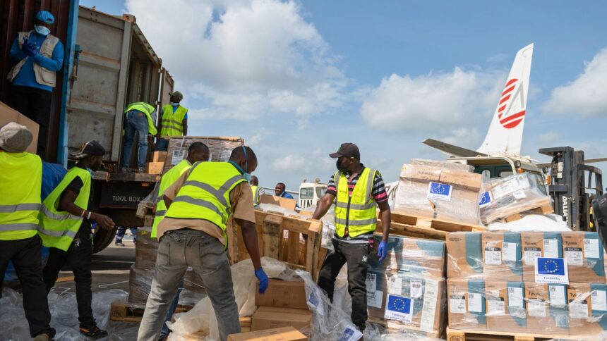 Workers offload medical and emergency supplies donated by European Union to support frontline workers in fighting Ebola upon arrival at the national airport in Bunia, Congo. Thursday, May 28, 2026. (AP Photo/Moses Sawasawa)