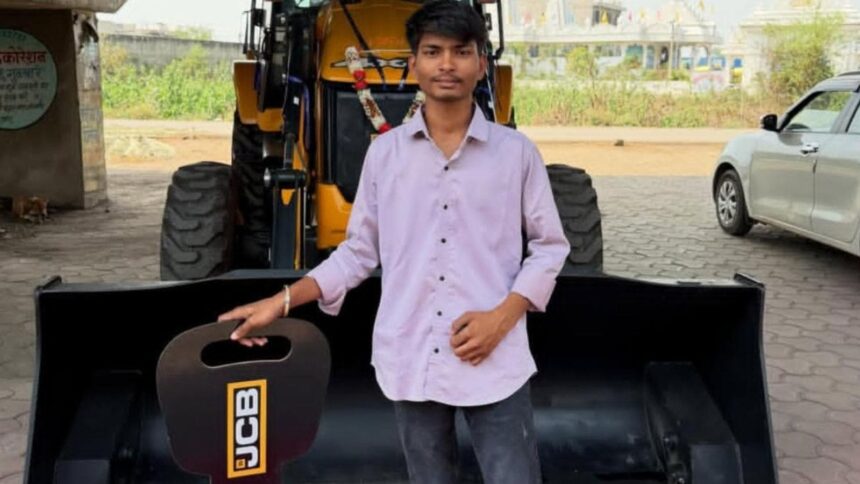 Ayush Kashyap, the deceased, standing in front of his new JCB. Express photo