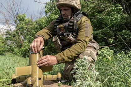 A Ukrainian soldier prepares an interceptor drone during a Russia's aerial attack at an undisclosed location near Kharkiv, Ukraine. (AP Photo)